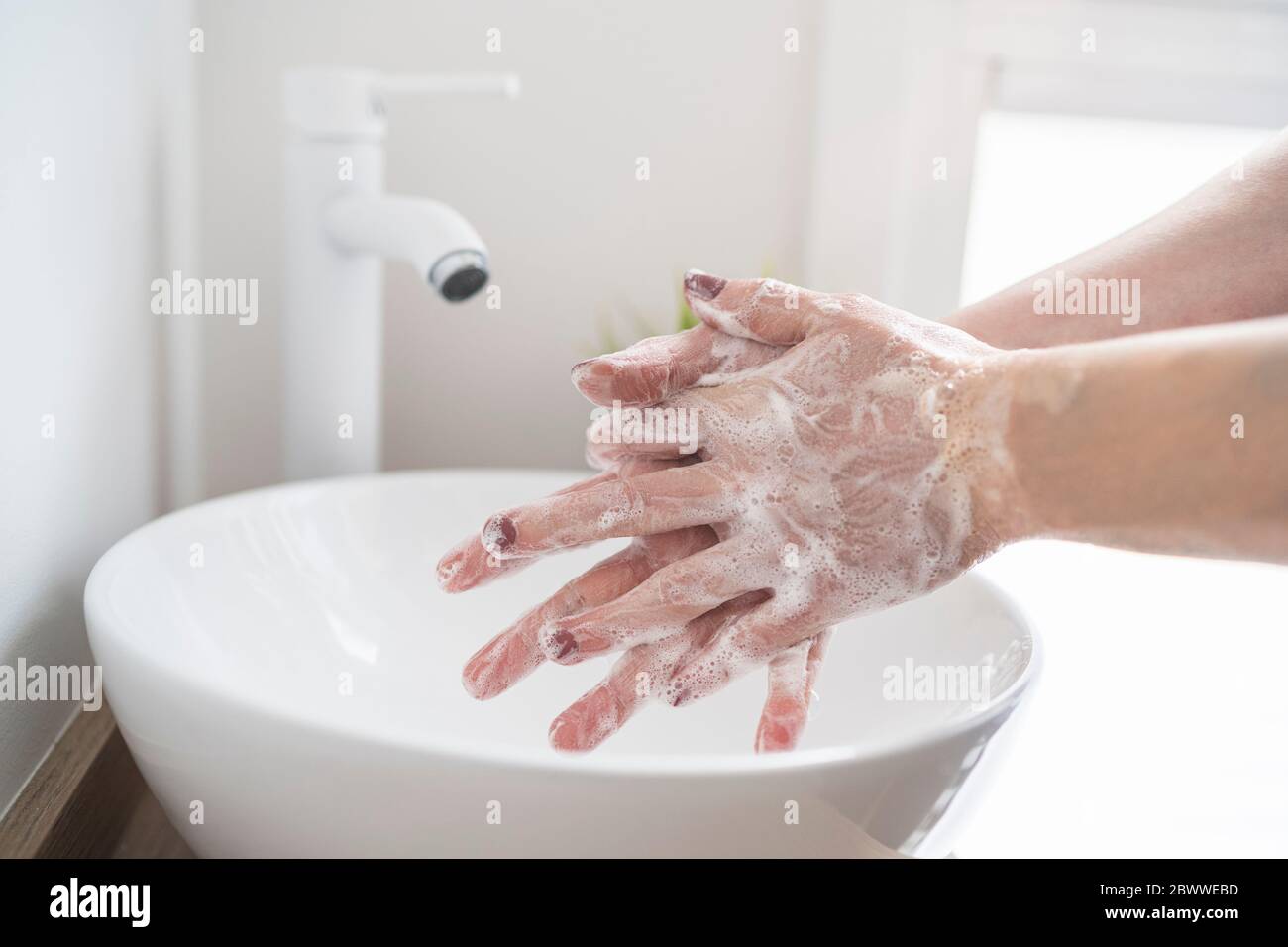 Close-up of woman washing her hand with soap Stock Photo - Alamy