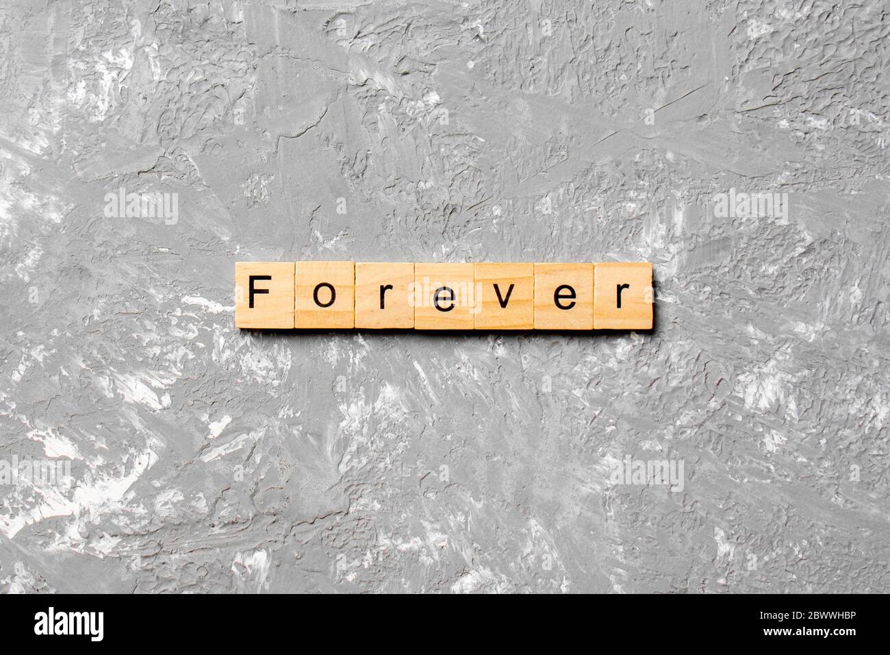 forever word written on wood block. forever text on table, concept. Stock Photo