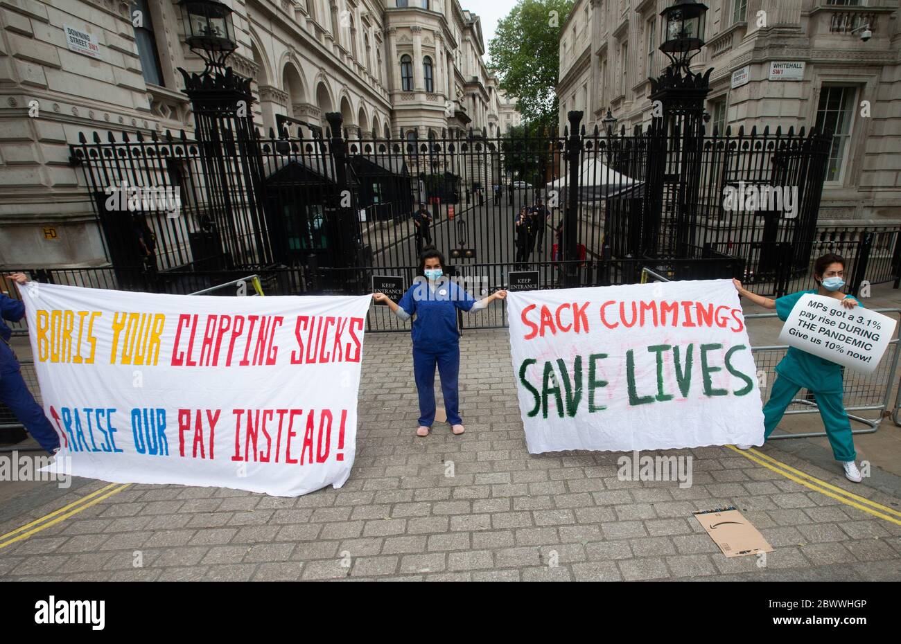 London, UK. 3rd June, 2020. Nurse Ameera Sheikh (centre) shows her support. NHS workers demonstrate at the gates of Downing Street. The are asking the Government for better pay. They are also showing support for the 'Black lives matter' campaign. Credit: Tommy London/Alamy Live News Stock Photo