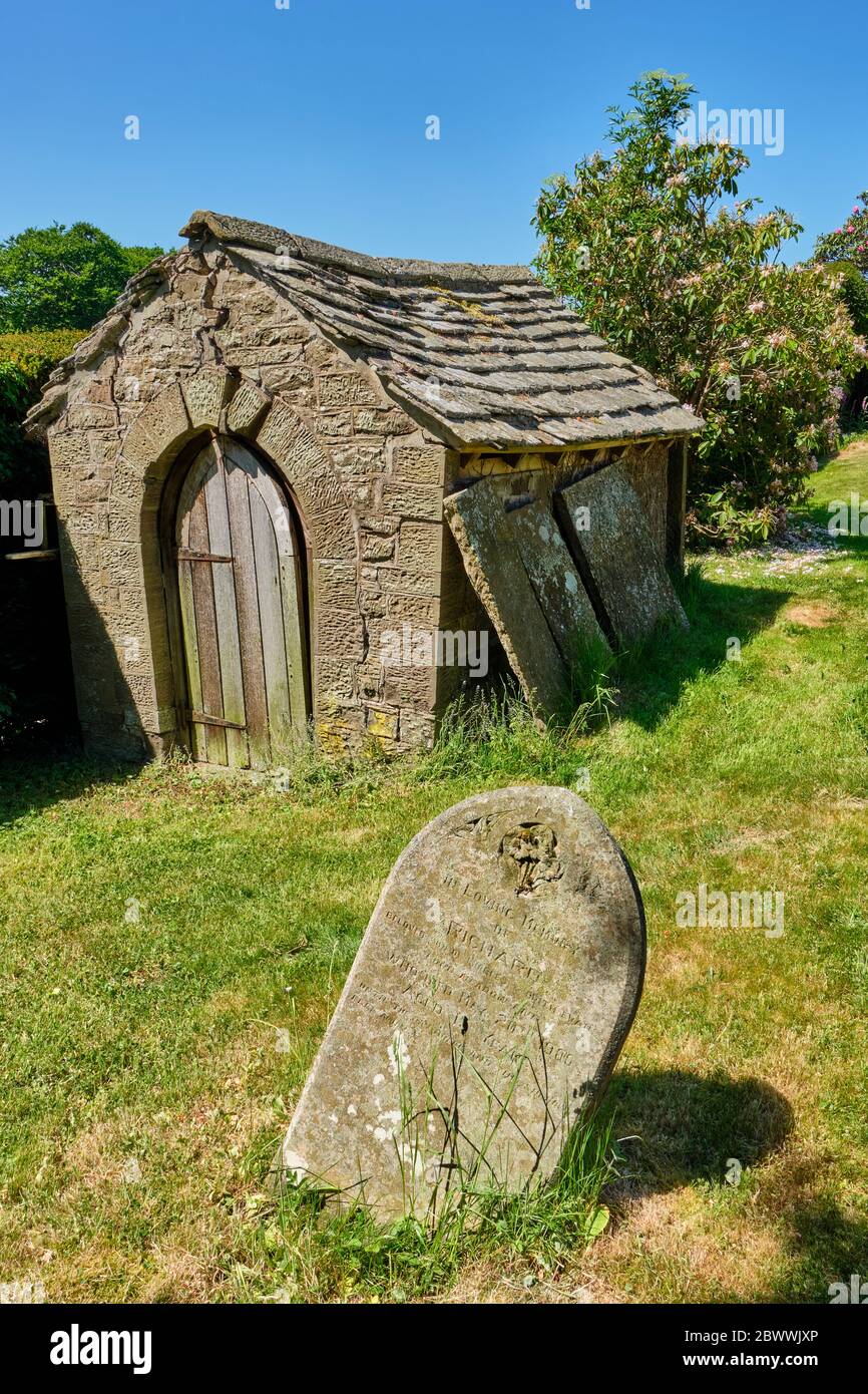 Stone outbuilding in the churchard of St Michael's Church, Sibdon Carwood, near Craven Arms, Shropshire Stock Photo