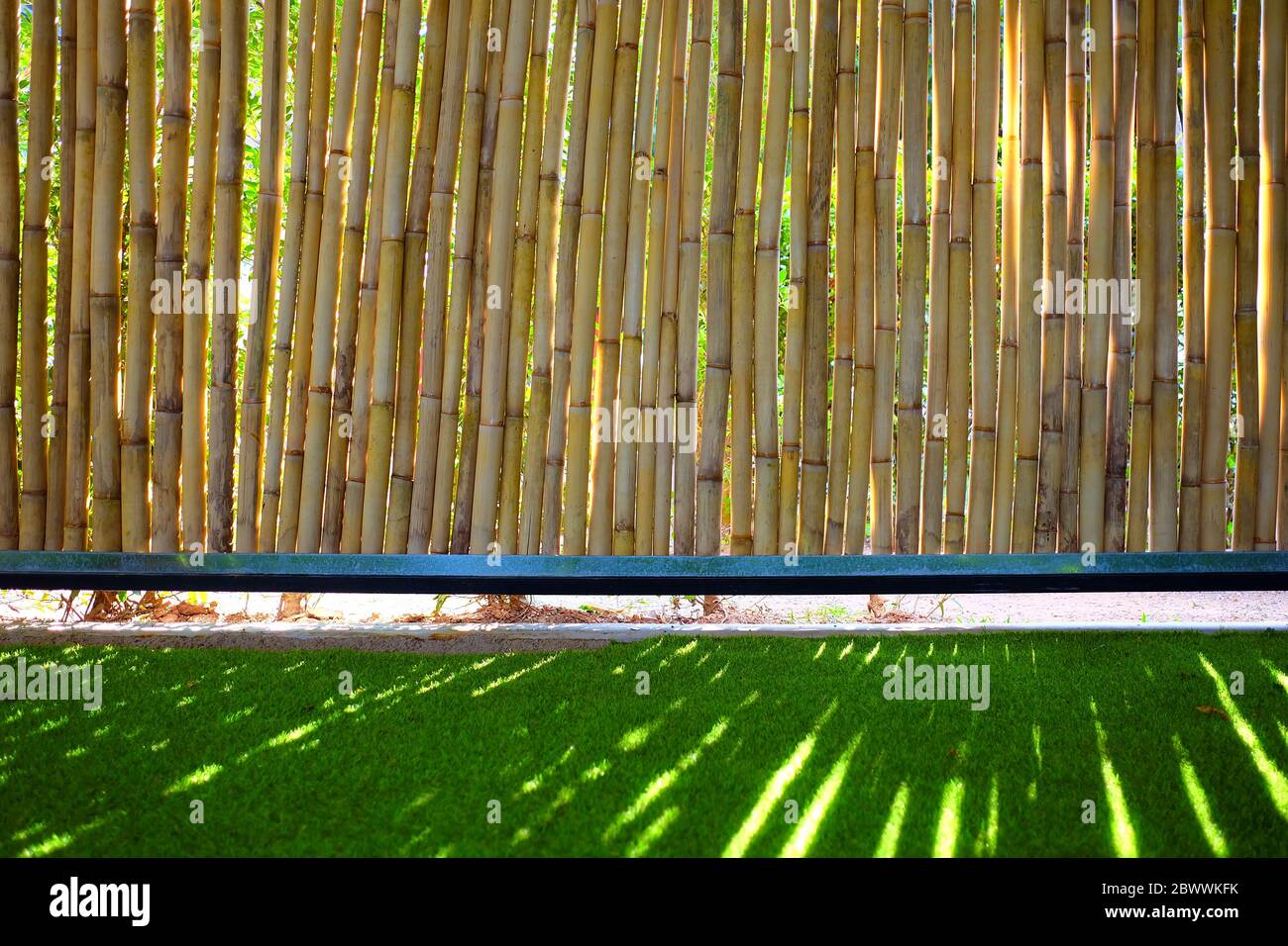 Bamboo Fence Background with Artificial Grass Stock Photo - Alamy