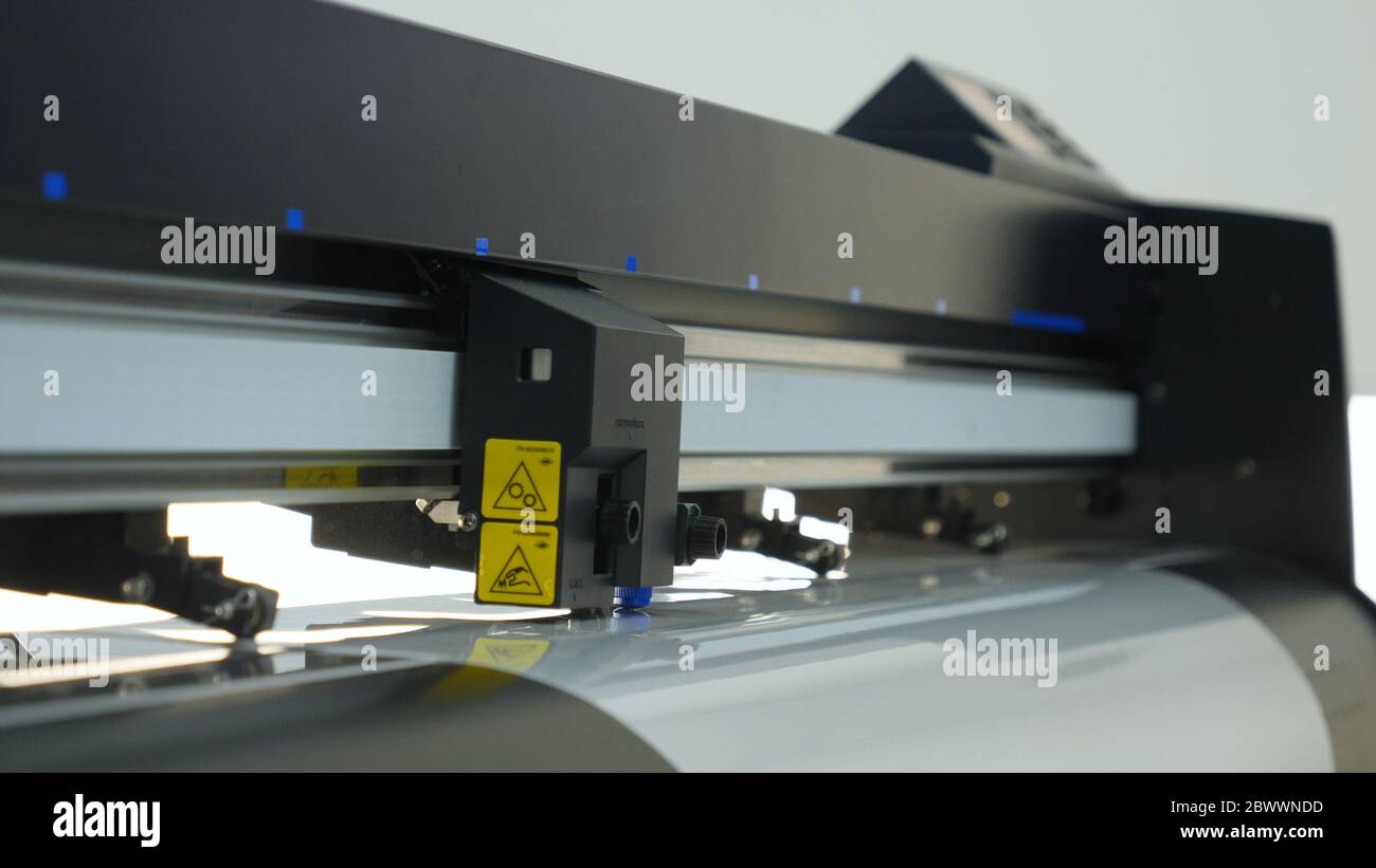 Industrial worker input data programing for CNC milling machine. Stock Photo