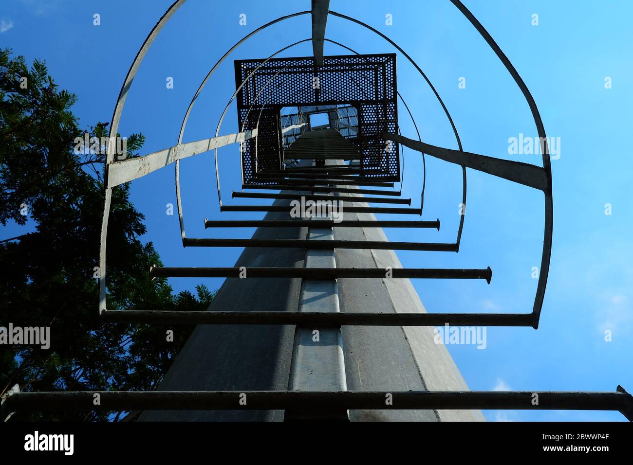 Bottom View of Steel Ladder to Tower. Stock Photo