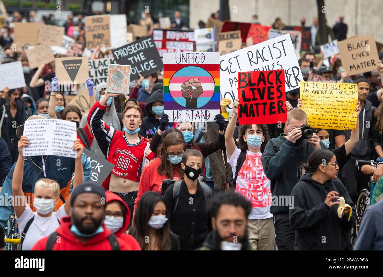People participate in a Black Lives Matter demonstration on Park Lane, London, in memory of George Floyd who was killed on May 25 while in police custody in the US city of Minneapolis. Stock Photo