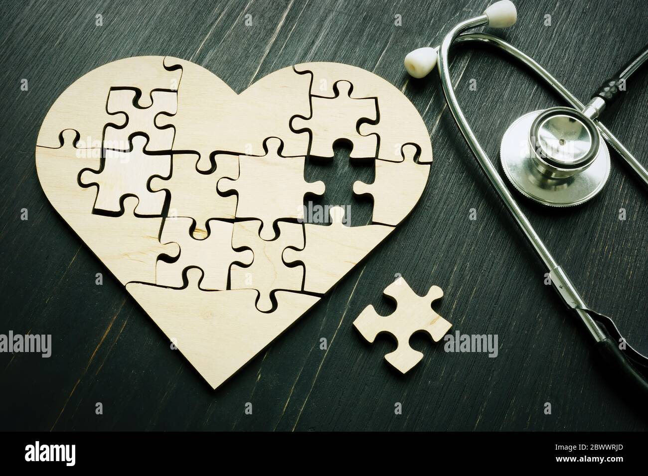 Heart disease like heart attack concept. Puzzle and stethoscope. Stock Photo