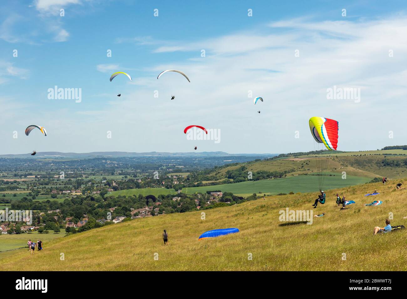 Hang gliders flying at Westbury White Horse, Westbury, Wiltshire, England, UK Stock Photo