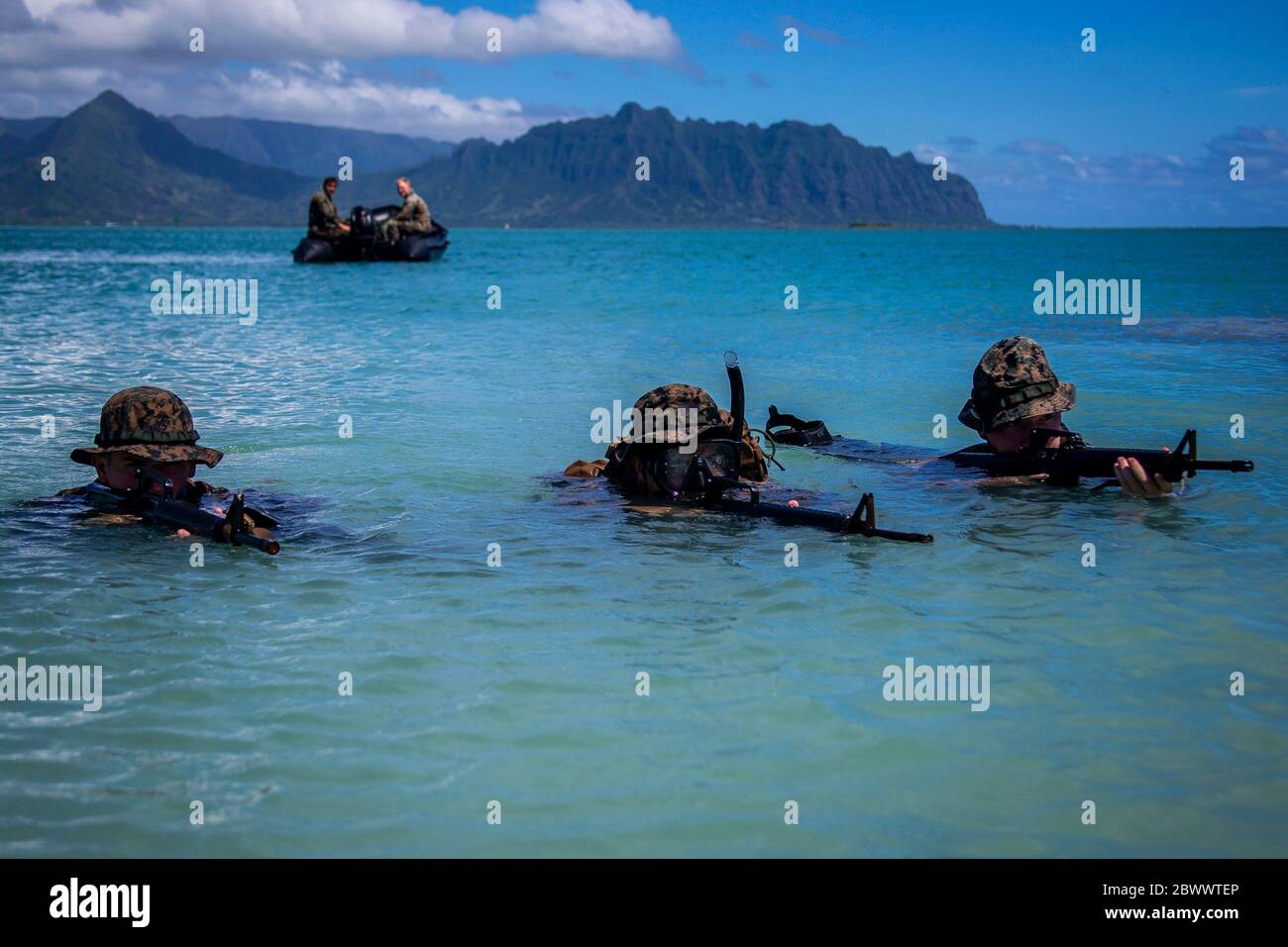 U.S. Marines with with Lima Company, 3rd Battalion, come ashore during an amphibious assault exercise, on the Mokapu Peninsula May 28, 2020 in O'ahu, Hawaii, USA. Stock Photo