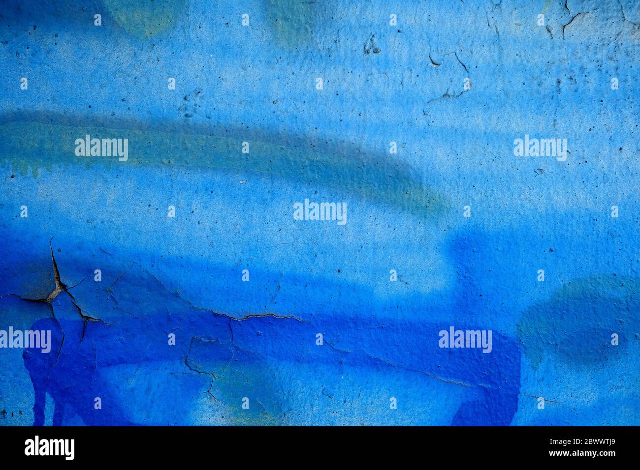 Blue Peeling Paint on Concrete Wall Texture Background. Stock Photo