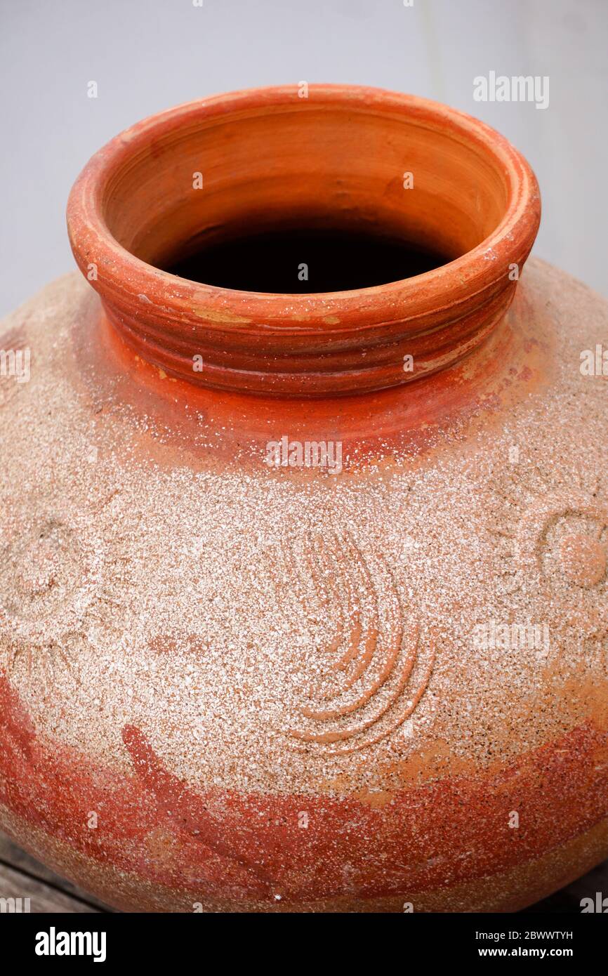 A close up shot of a clay pot.Pottery is the process of forming vessels