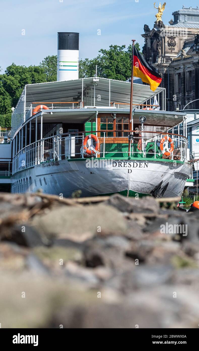 Dresden, Germany. 03rd June, 2020. The stern of the paddle steamer "Dresden" seems to be lying on dry land at the Brühlsche Terrasse. The Sächsische Dampfschiffahrt Dresden (SDS) has filed for insolvency. The background is financial difficulties, for which the SDS last week blamed the missing tranche of a loan from the Free State. The "White Fleet" operates with nine paddle steamers built between 1879 and 1929 as well as two modern passenger ships and is considered the oldest and largest fleet of paddle steamers in the world. Credit: Robert Michael/dpa-Zentralbild/dpa/Alamy Live News Stock Photo
