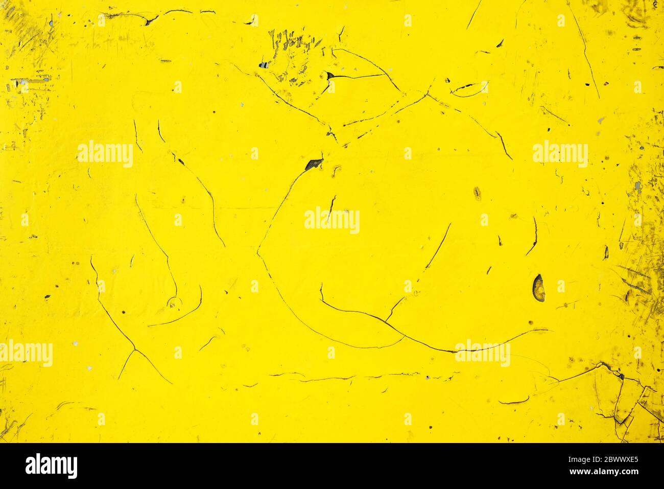 Old Yellow Painting on Wall Background. Stock Photo