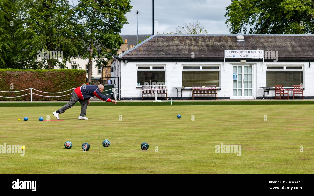 Haddington, East Lothian, Scotland, UK, 03 June 2020. Scotland's oldest bowling club reopening: Scotland’s oldest bowling club reopens after lockdown restrictions are eased. The club celebrated its 300th anniversary in 2009, and has about 75 full members. Pictured: Scott Milne, one of four club member first to play on the green today after the club closed last September Stock Photo