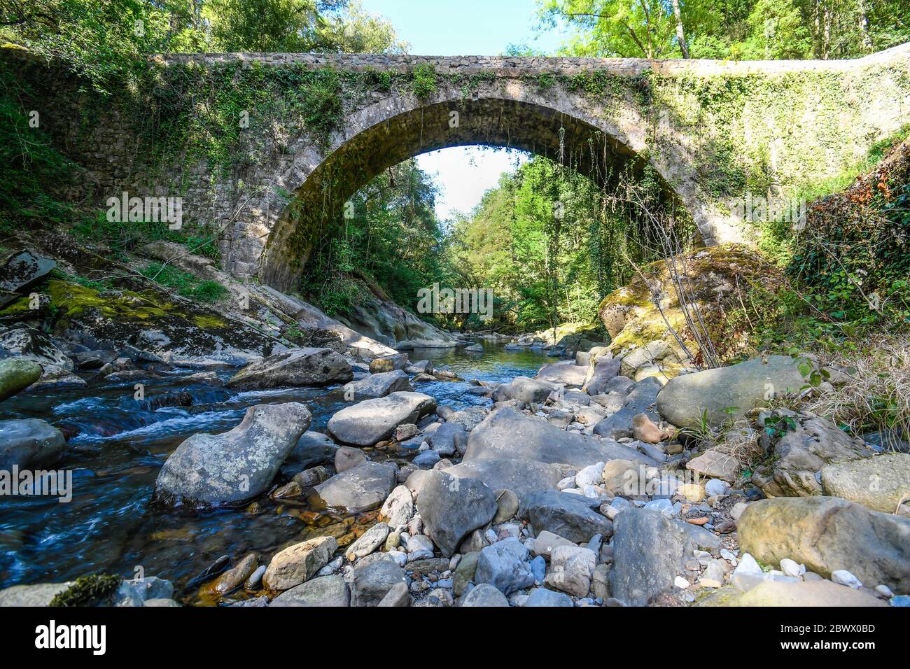 Bridge over the Barbadún river as it passes through the La Olla ironworks in Galdames Stock Photo