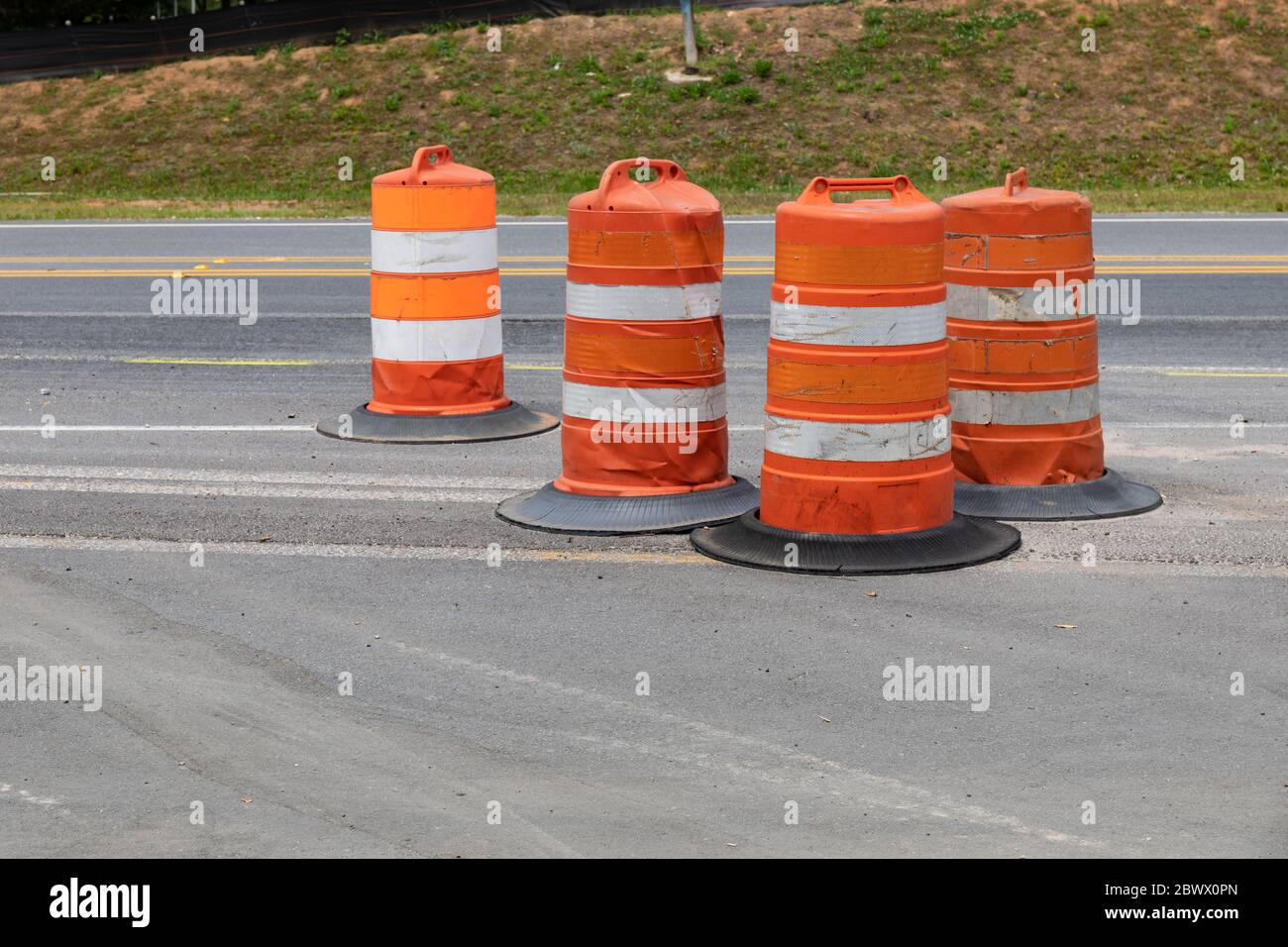 Collection of traffic safety barrels, road construction safety zone