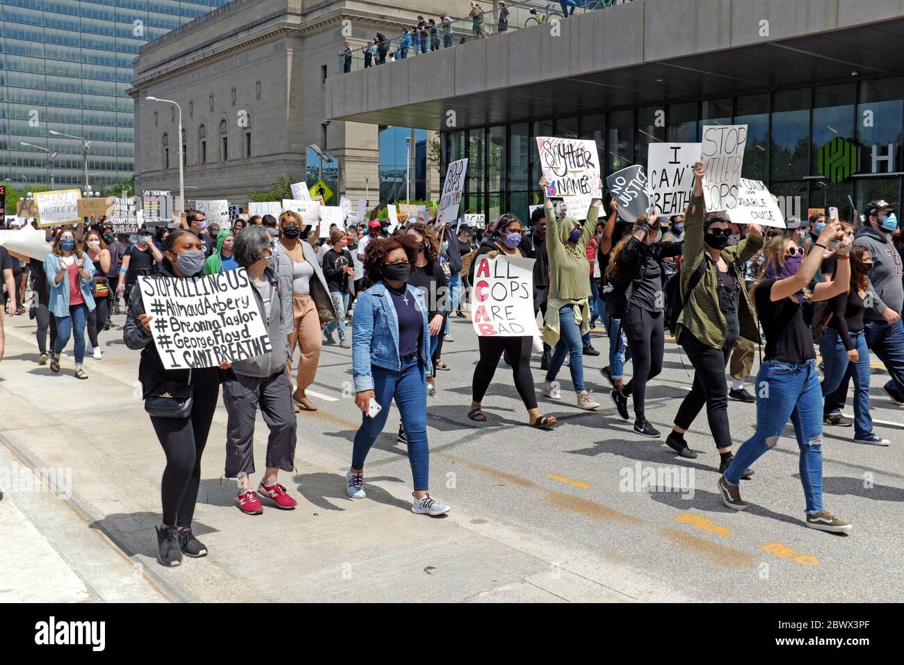 Peaceful protesters march down Lakeside Avenue in Cleveland, Ohio protesting the killing of George Floyd, as well as others, at the hands of police. Stock Photo