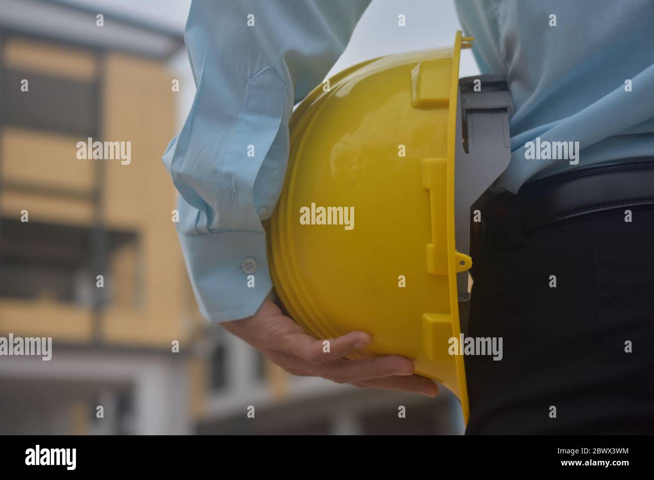 Engineering holding Yellow hard hat safety work construction
