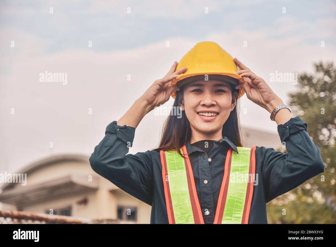 Asian Woman Engineering Yellow helmet hard hat safety Stock Photo Alamy