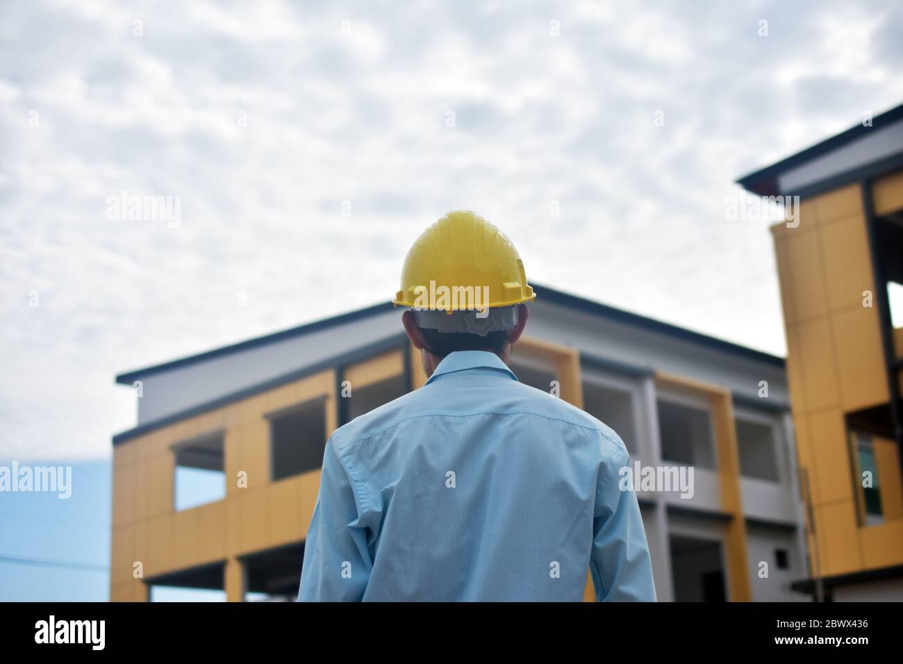Engineer standing worker building estate construction  background Stock Photo