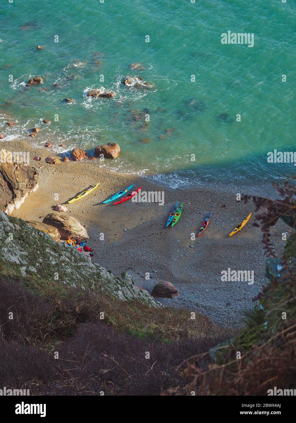 Sea kayaks on the beach in Ireland, sun and sea, a tiny hidden beach