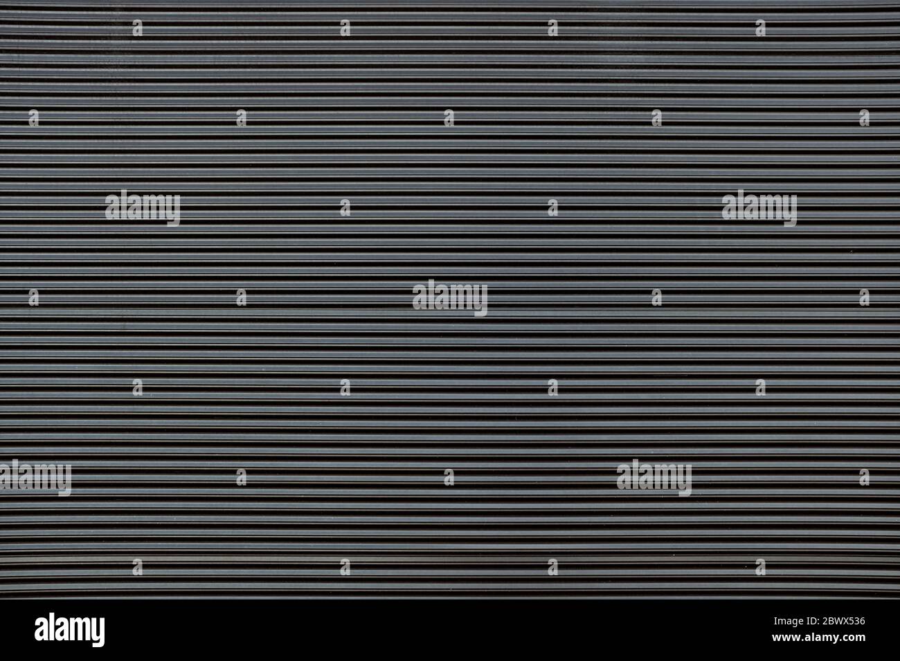 Old Black Striped Metal Wall Texture Background. Stock Photo