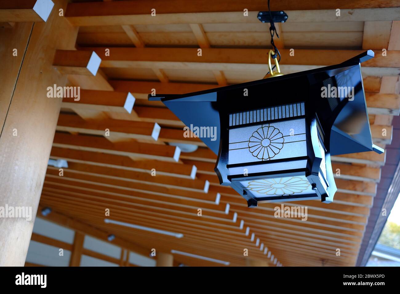 Vintage Japanese Lamp Hanging on the Roof in the Temple. Stock Photo