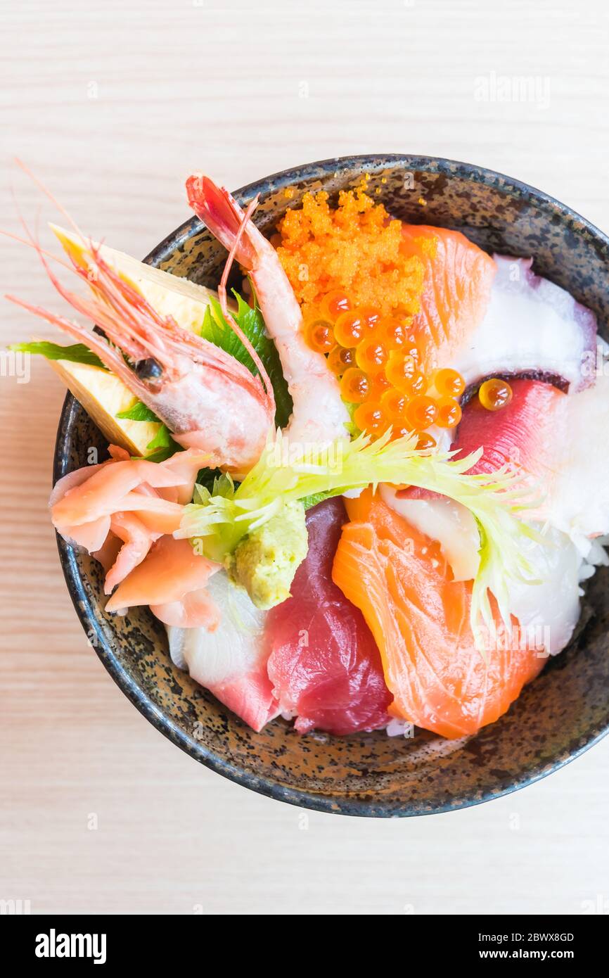 Japanese rice bowl with sashimi seafood on top Selective focus point