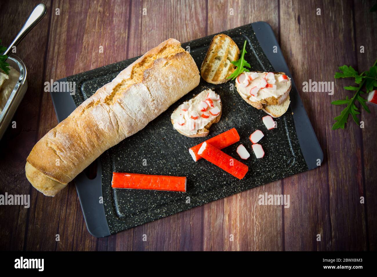 cheese sandwich and crab sticks on top Stock Photo Alamy