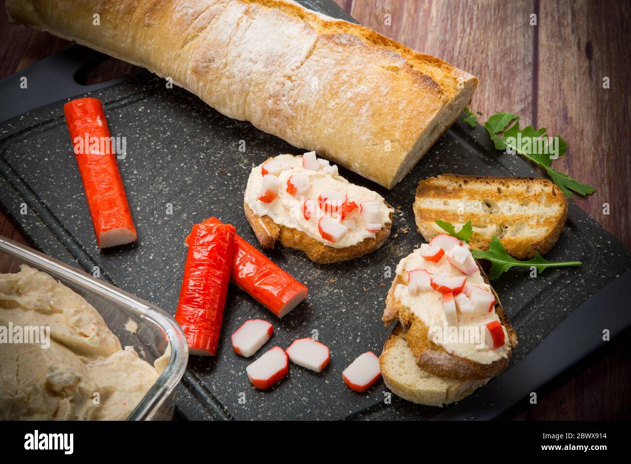 cheese sandwich and crab sticks on top Stock Photo Alamy