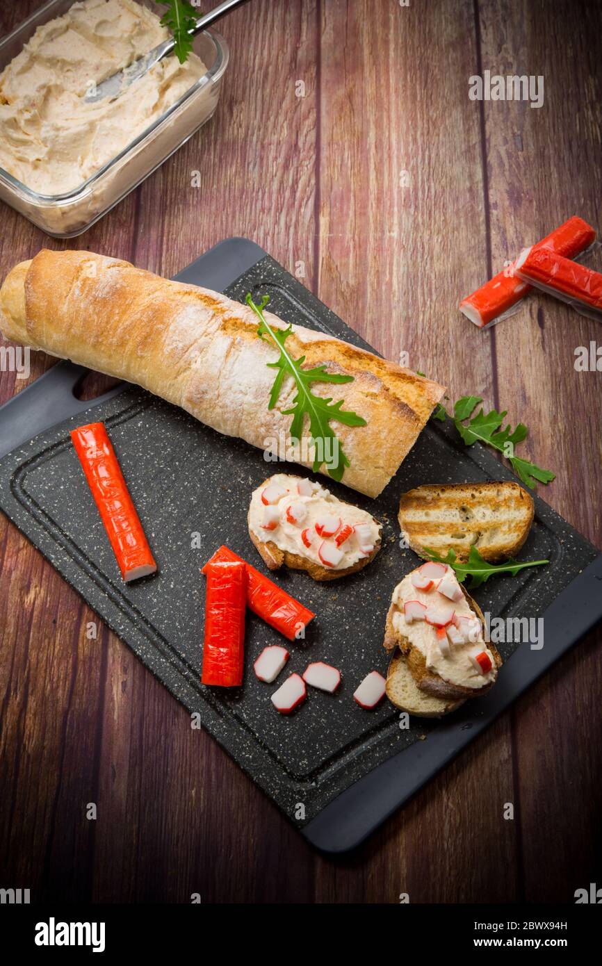 cheese sandwich and crab sticks on top Stock Photo Alamy