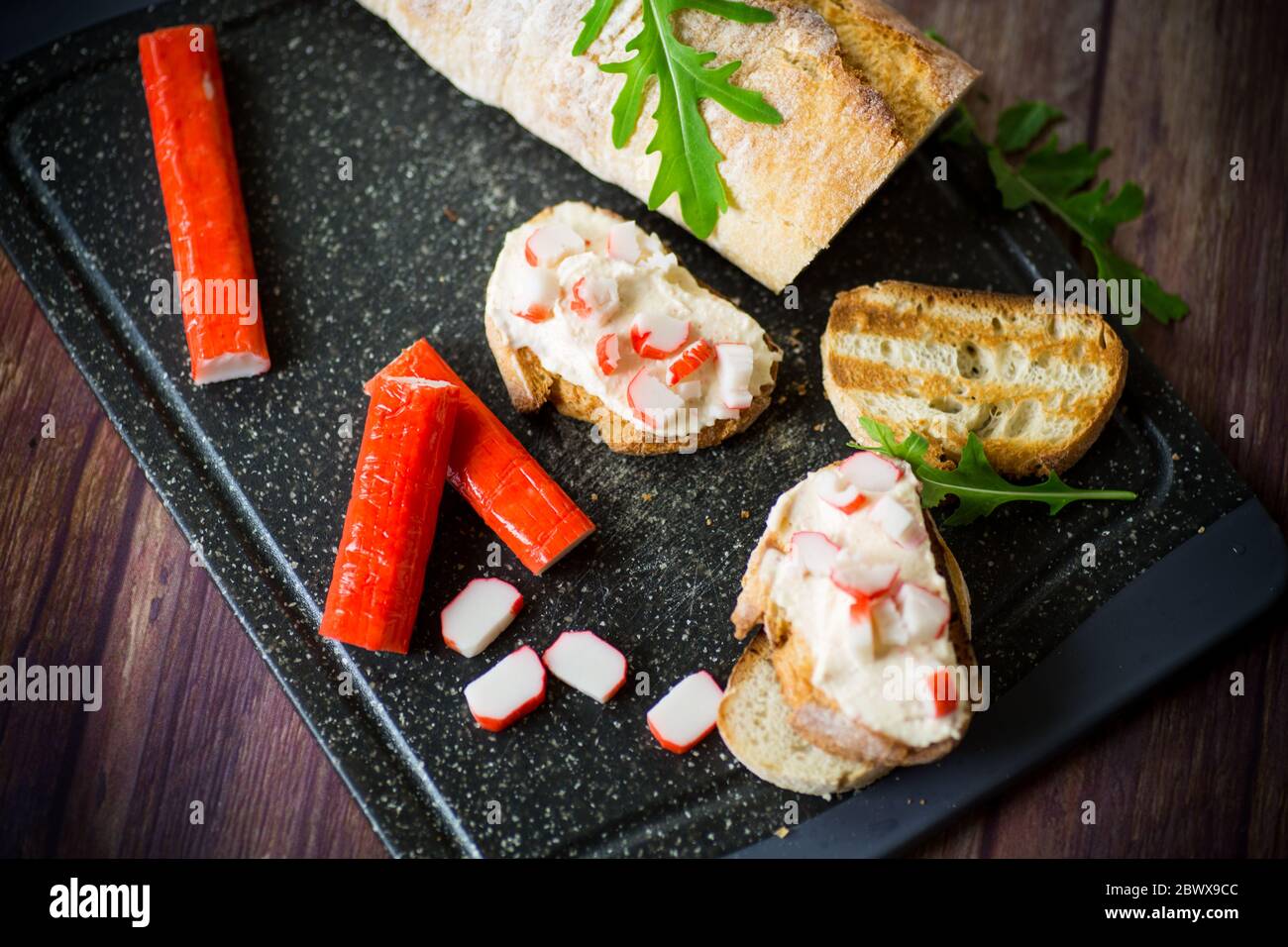 cheese sandwich and crab sticks on top Stock Photo Alamy