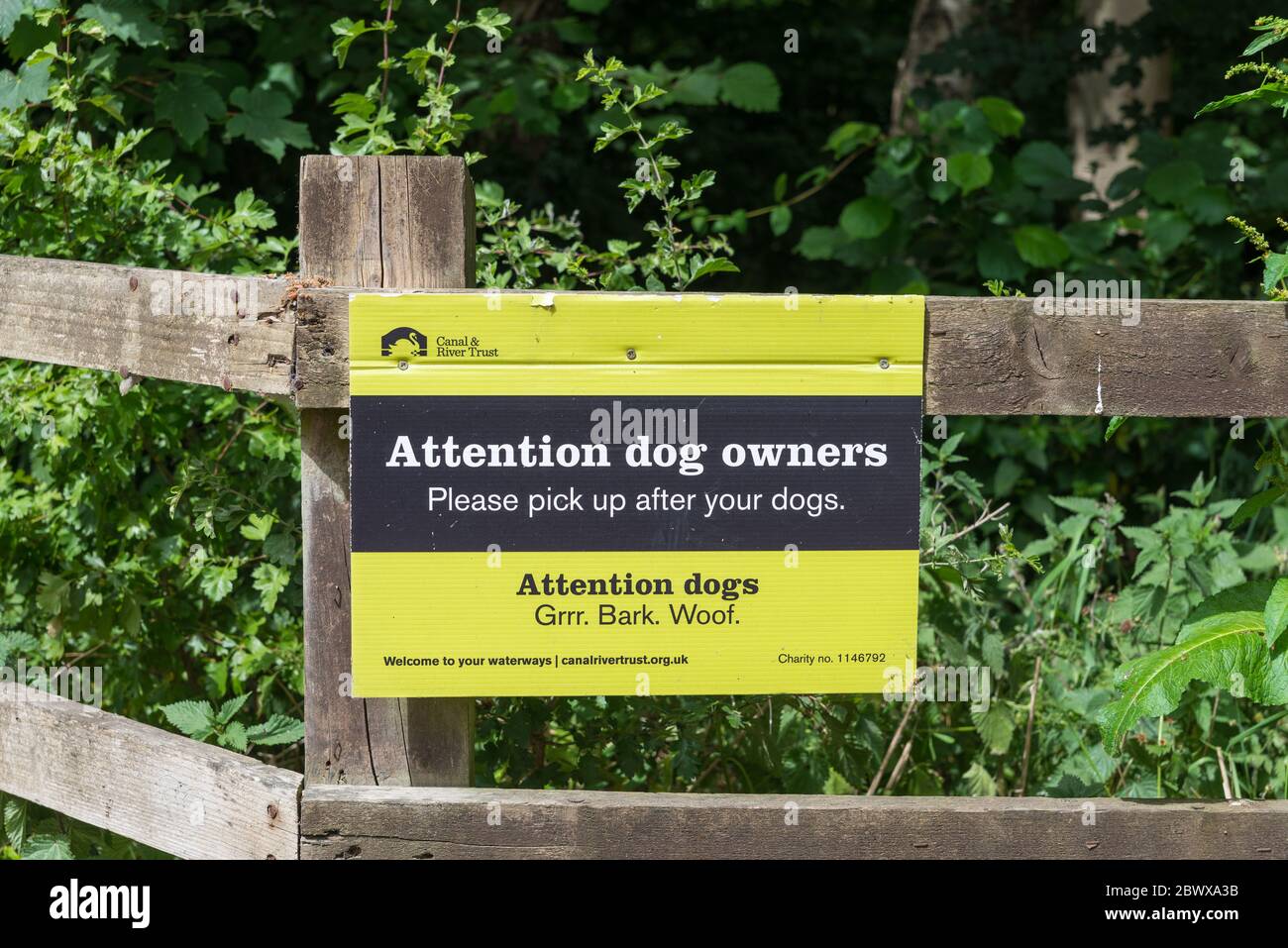 Attention dog owners sign at Fradley Junction in Staffordshire which is at the junction of the trent and mersey canal and coventry canal Stock Photo