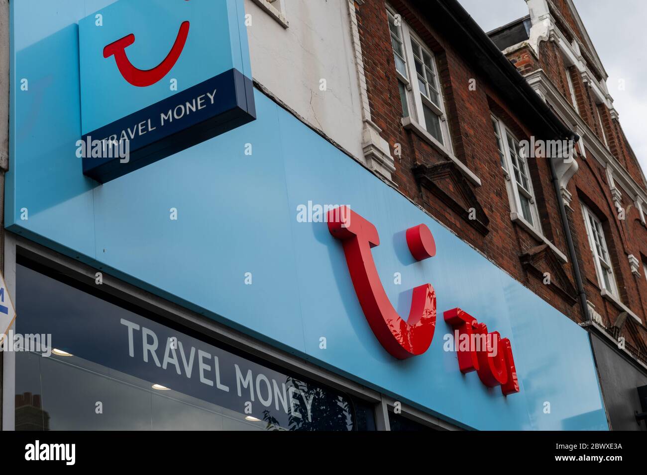 Shop signs and logo of the travel agent TUI, previously know as Thompson. TUI Group is on of the world's biggest travel and holiday company. Stock Photo
