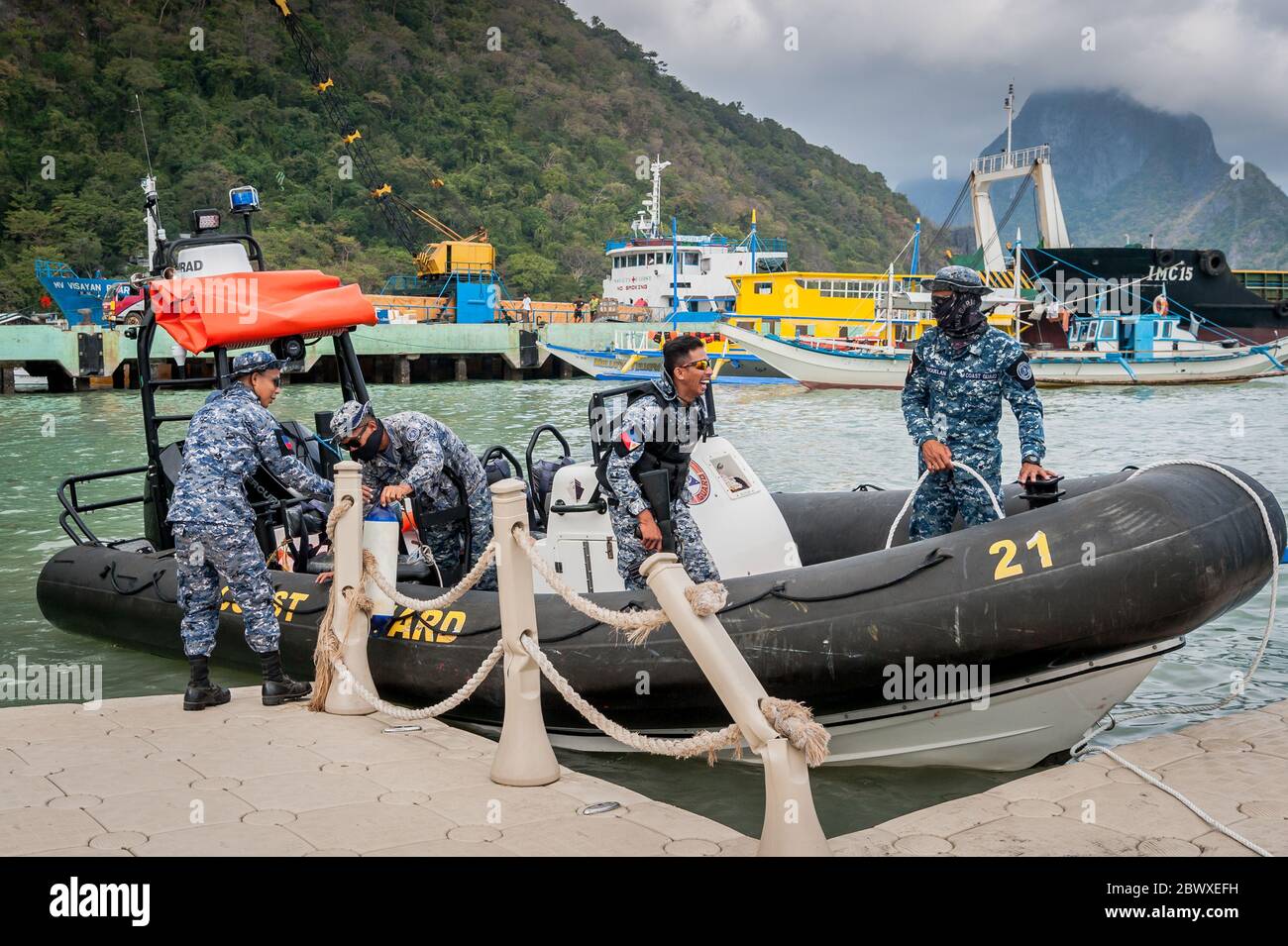 Armed Philippine coast guards come into port at El Nido, Palawan. The