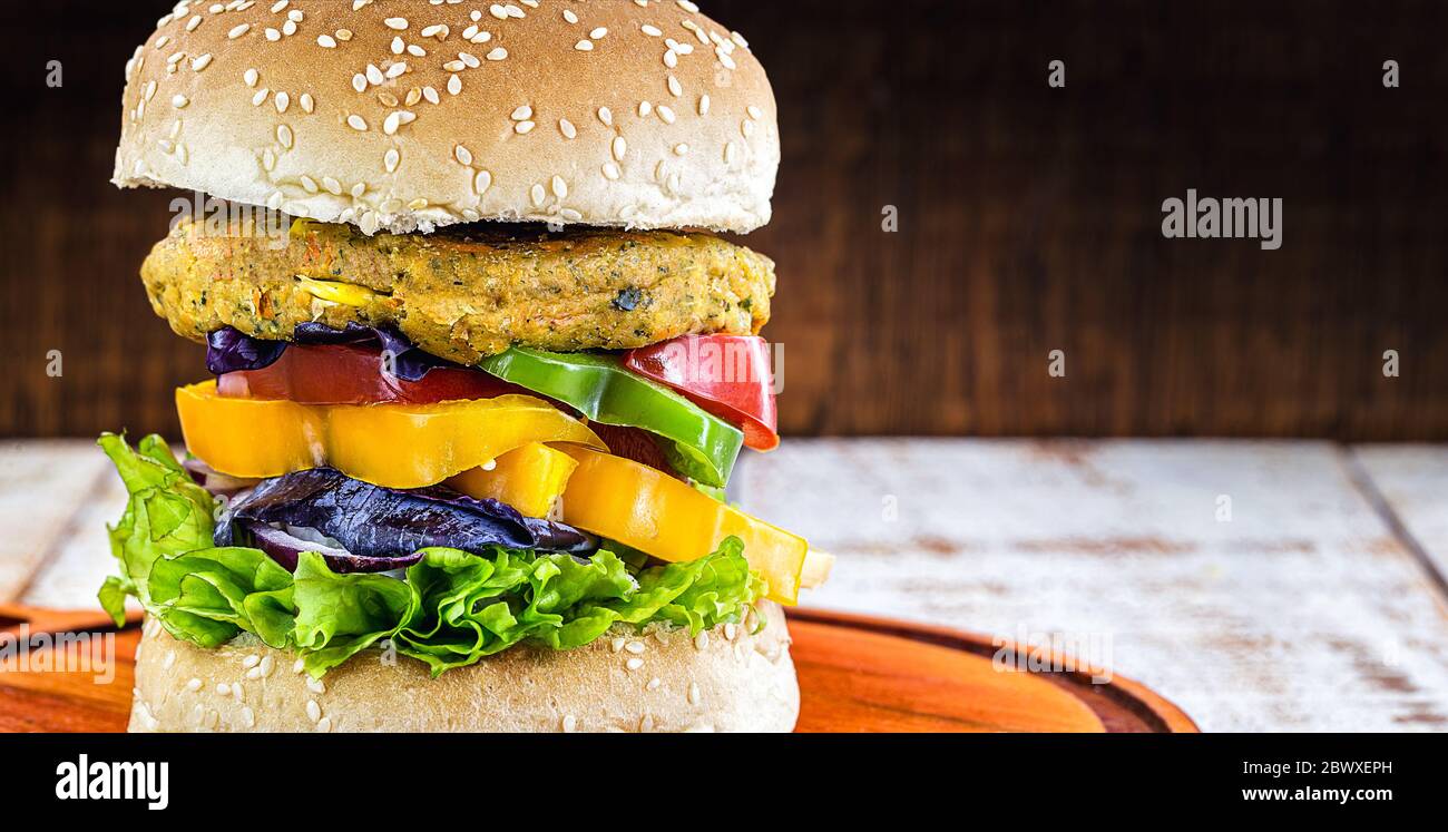 Vegetarian burger, Sandwich made without meat. It can be made from corn, potatoes, textured soy protein, legumes, tofu, mushrooms or cereals. Stock Photo