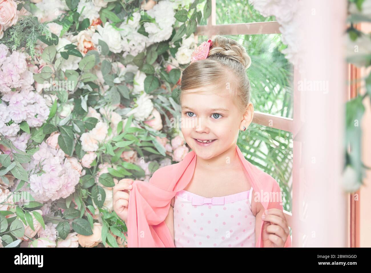 portrait of a beautiful little girl with a pink bow and cape Stock ...
