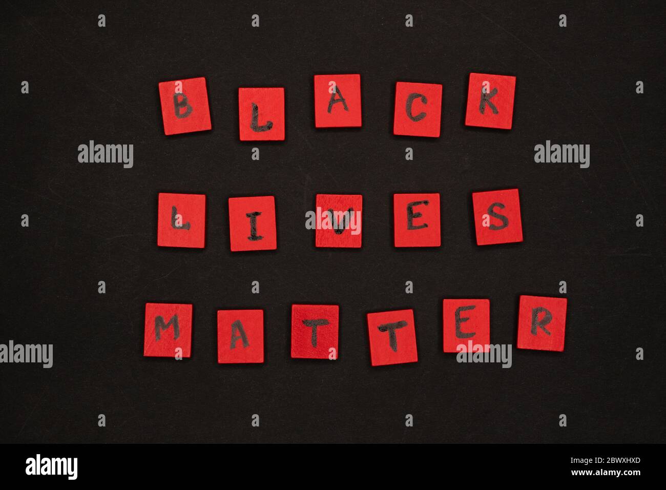 inscription black lives matter. protest signs. lettering. red letters on wooden squares on a black background. I can t breathe. Stock Photo
