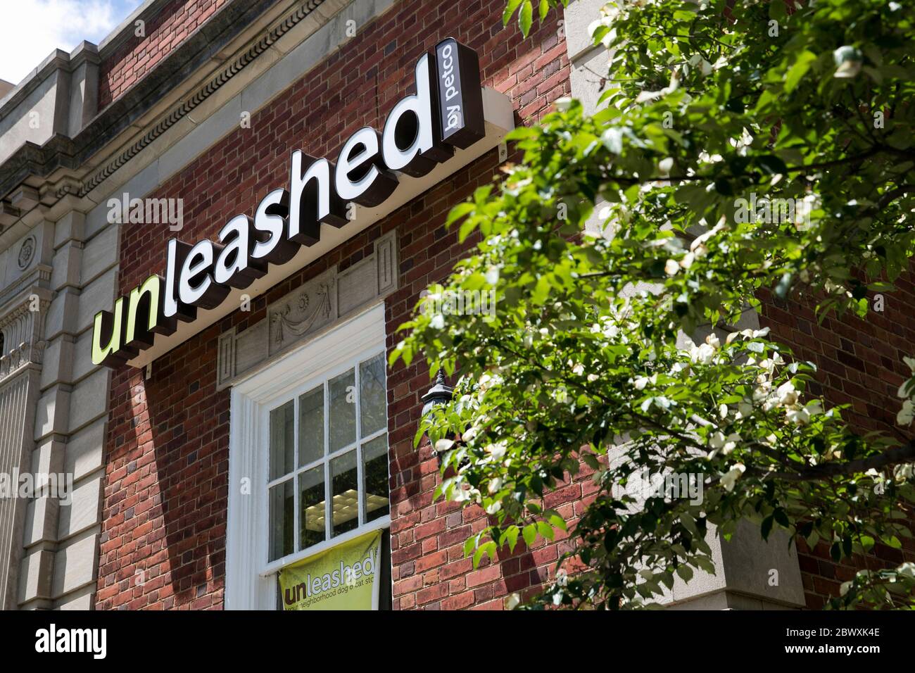 A logo sign outside of a Unleashed by Petco retail store location in Silver Spring, Maryland on May 23, 2020 Stock Photo