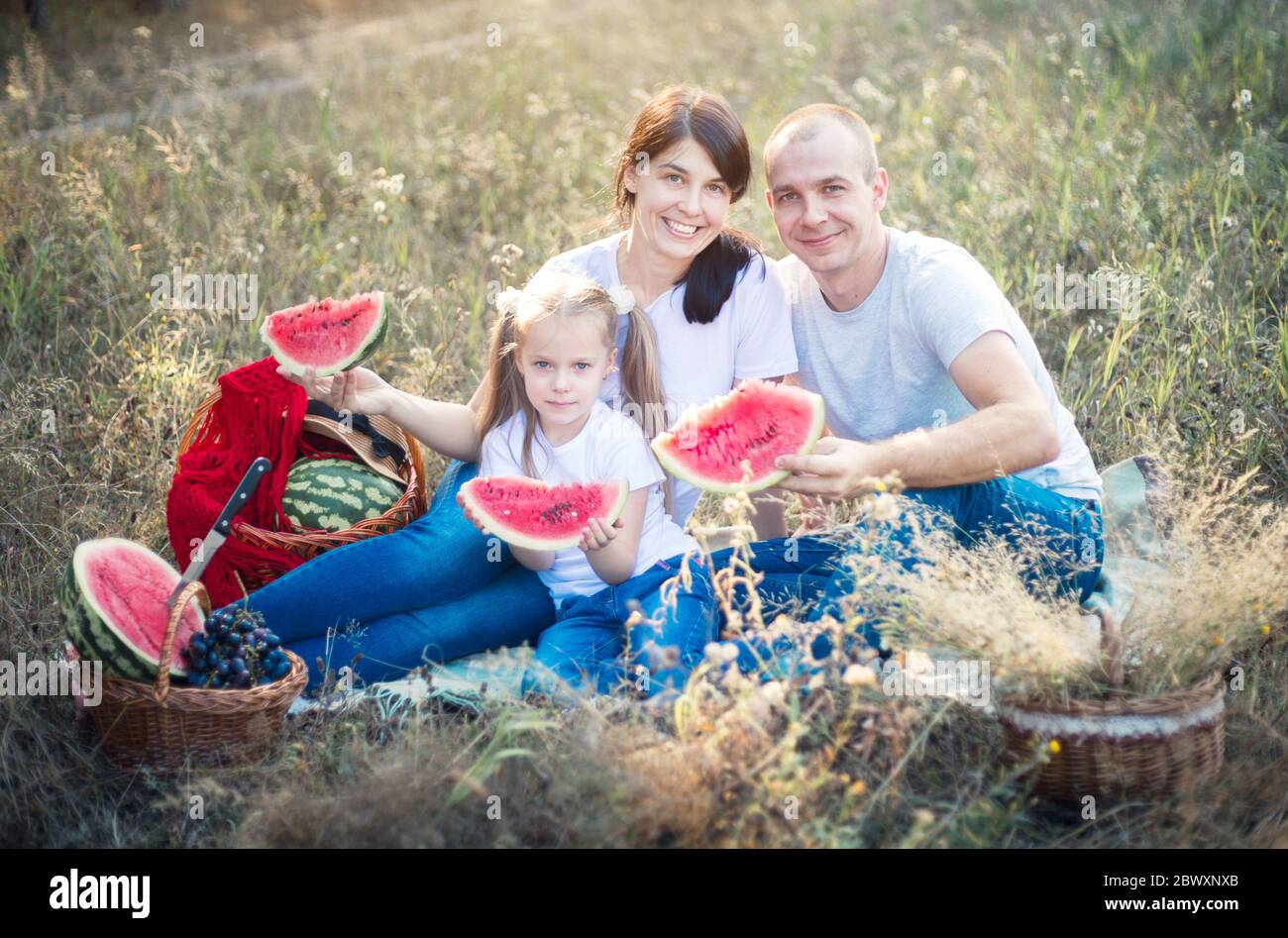 Family on a summer picnic. Watermelon and fruits Stock Photo Alamy