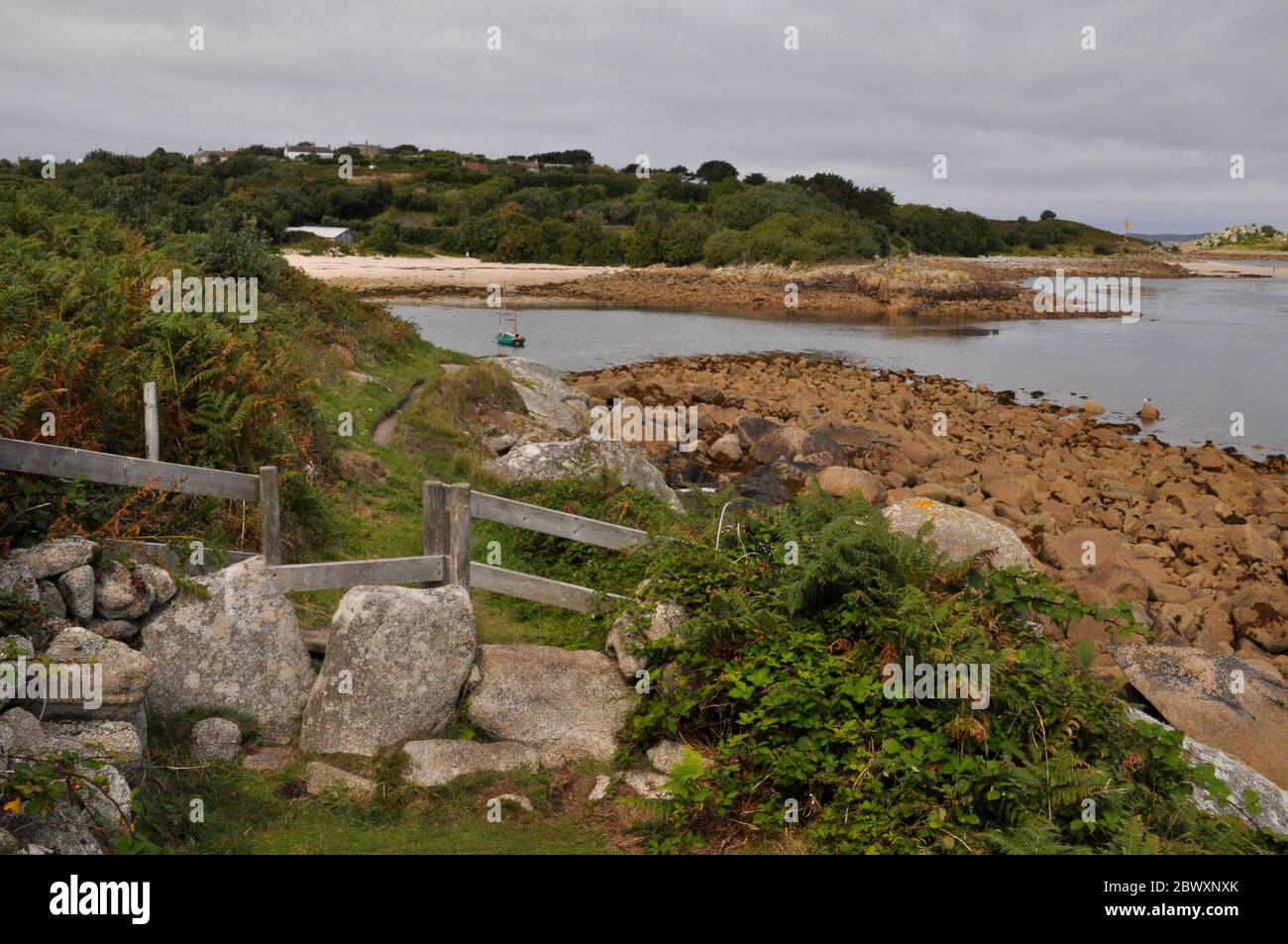 Stile on the quiet coastal footpath around the island of St Agnes, Isles of Scilly, Cornwall, UK Stock Photo
