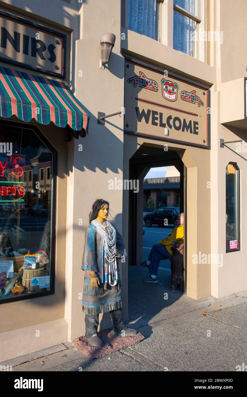 Statue wearing native clothing at Grizzly's Alaskan Gifts shop on 4th Avenue at E Street in downtown Anchorage, Alaska, AK, USA. Stock Photo