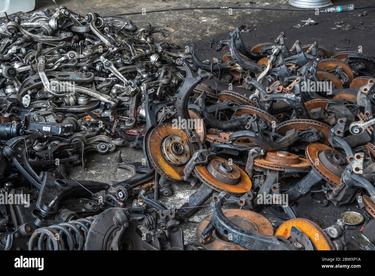 used brake rotor and car part at junkyard or scrapyard for recycling