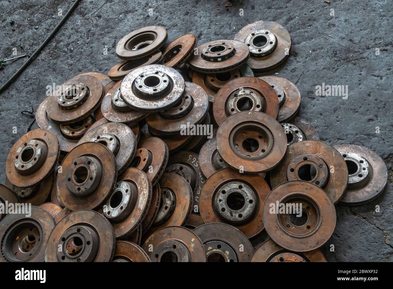 used brake rotor and car part at junkyard or scrapyard for recycling