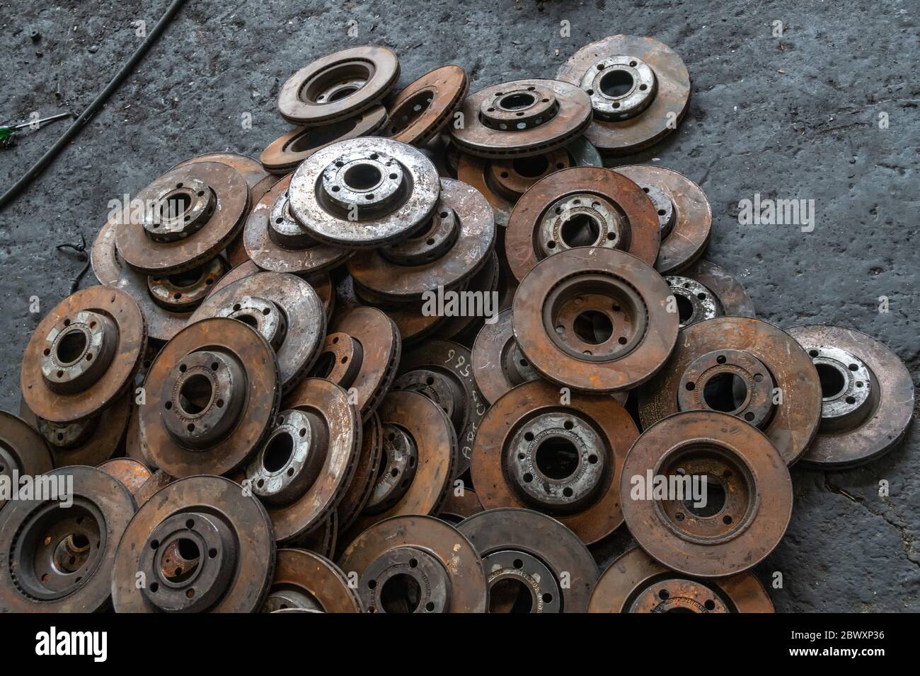 used brake rotor and car part at junkyard or scrapyard for recycling