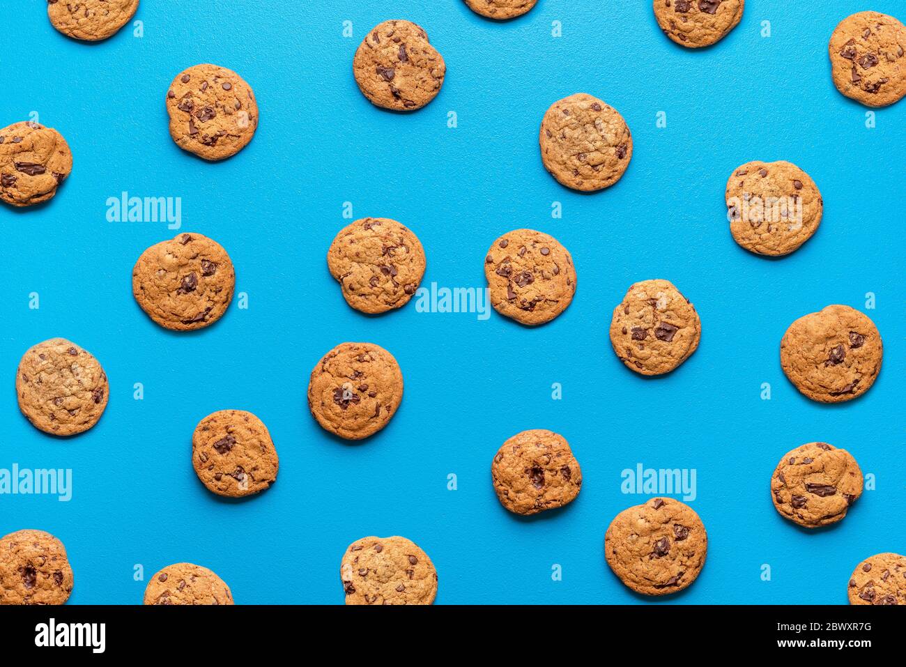 Brown Chocolate Chip Cookies Background On A Vibrant Blue Backdrop Flat Lay With Cookies Pattern Sweet Treats Background Many Choco Snacks Stock Photo Alamy