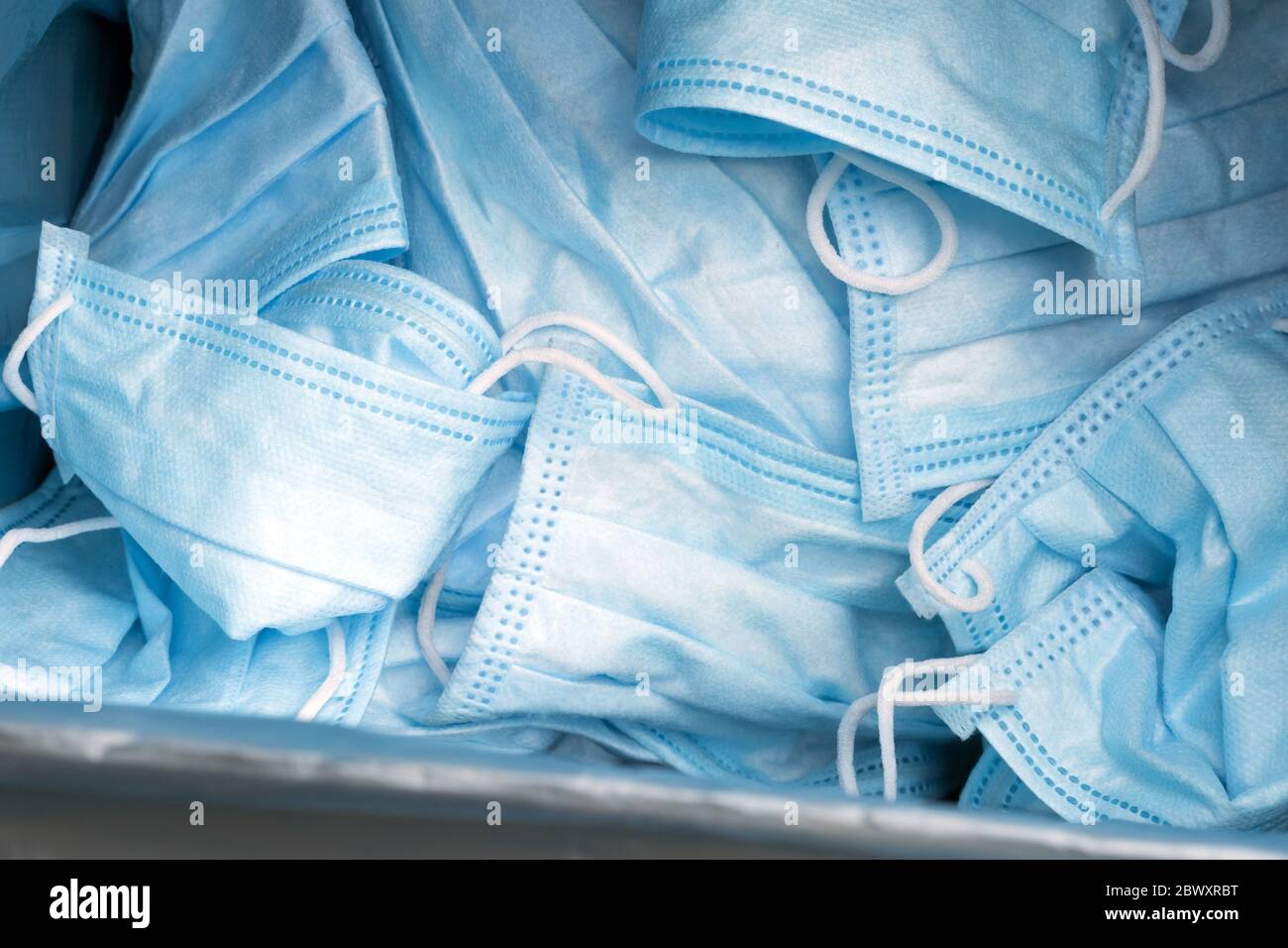 Used hygienic mask in trash bin. Separating infected waste. Pollution ...