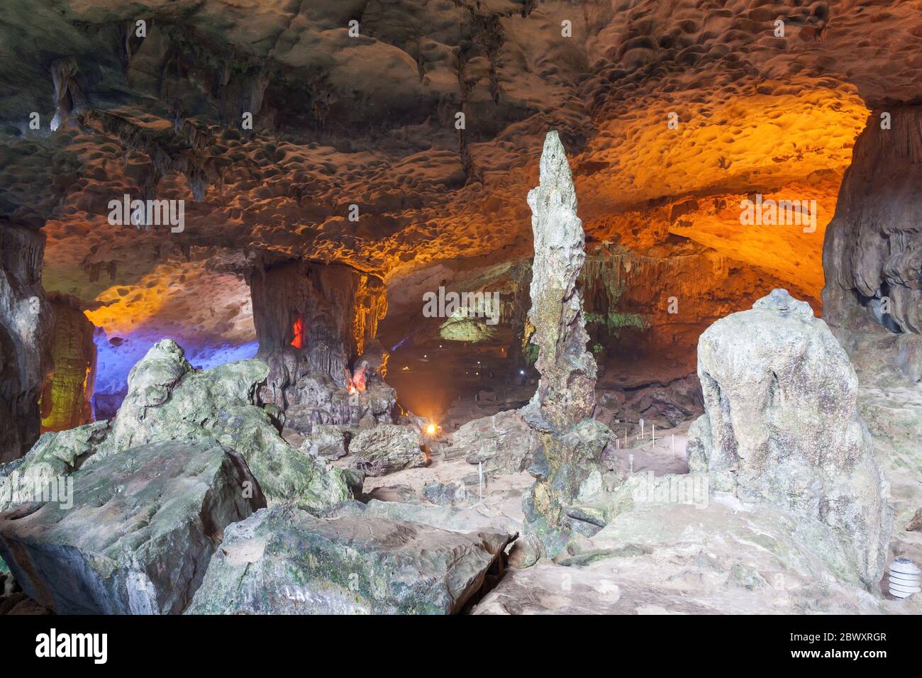 Stalactite and stalagmite formations in a limestone cave of Halong Bay, Vietnam Stock Photo