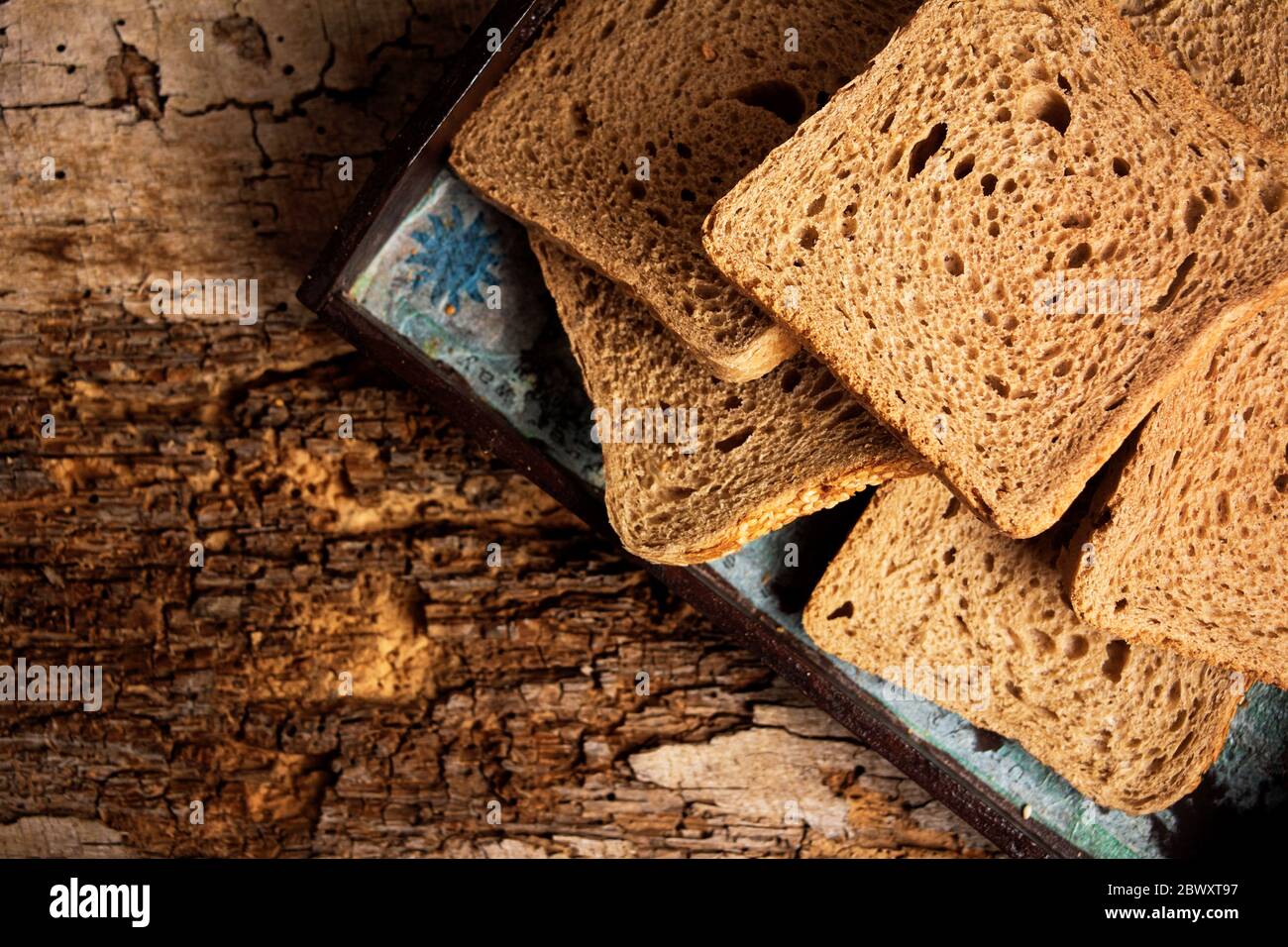 Sliced rye bread on a Board on a wooden table top view Stock Photo