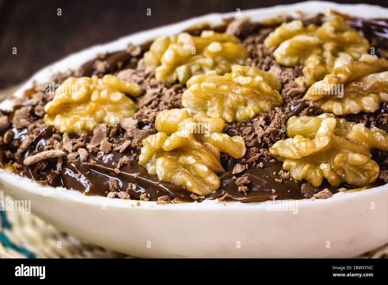 chocolate easter egg with icing and nut filling. Gourmet Easter egg