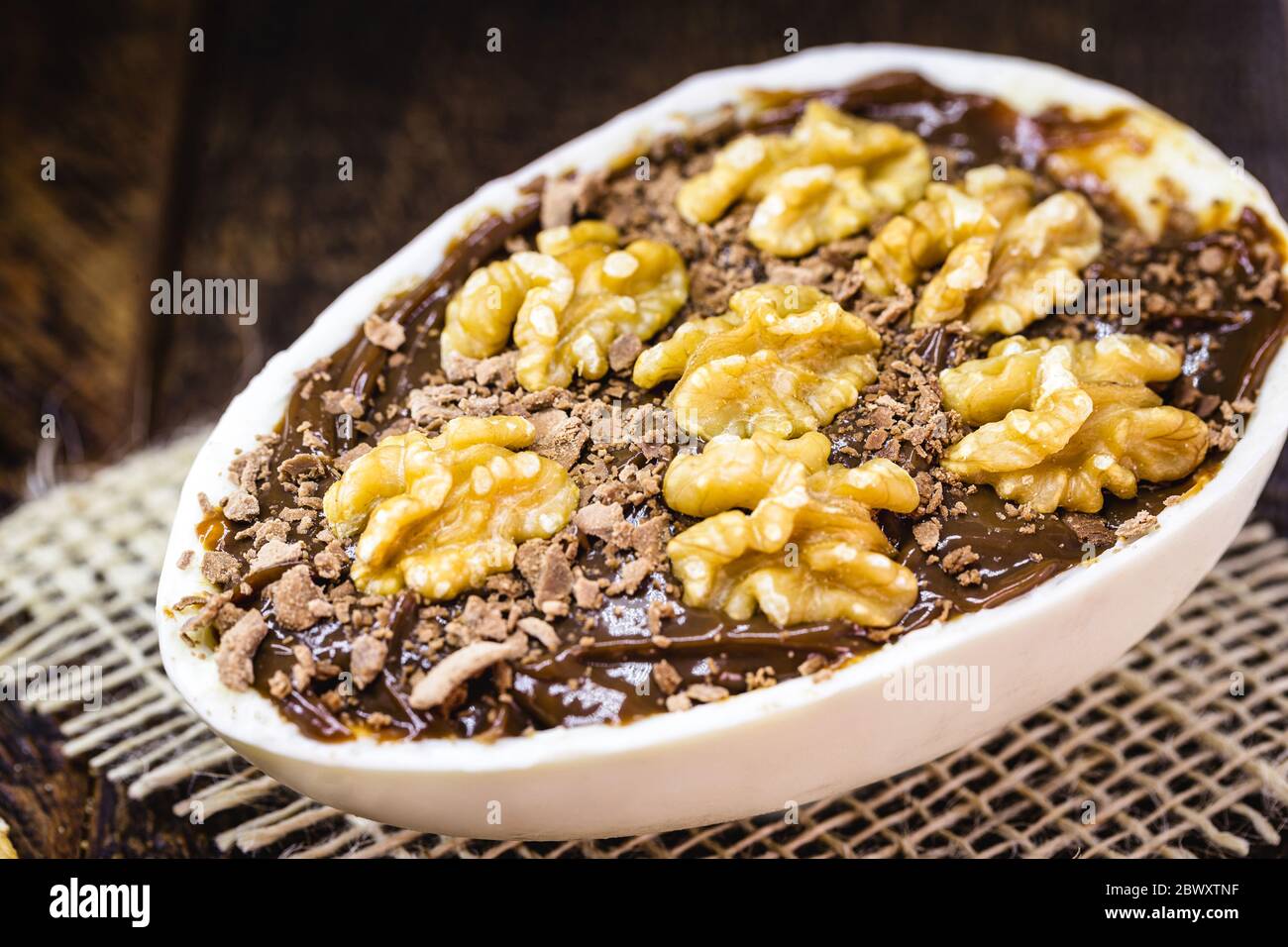 chocolate easter egg with icing and nut filling. Gourmet Easter egg