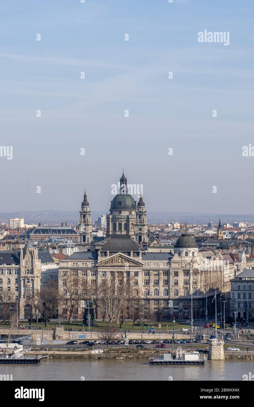 Gresham Palace with St. Stephen's Basilica on Danube riverside in Budapest winter morning Stock Photo